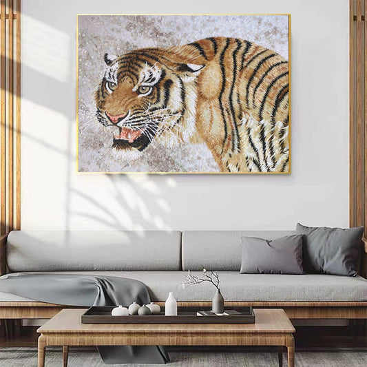 Powerful tiger glass mosaic artwork with intense amber eyes and detailed stripes displayed in modern living room with natural wood accents