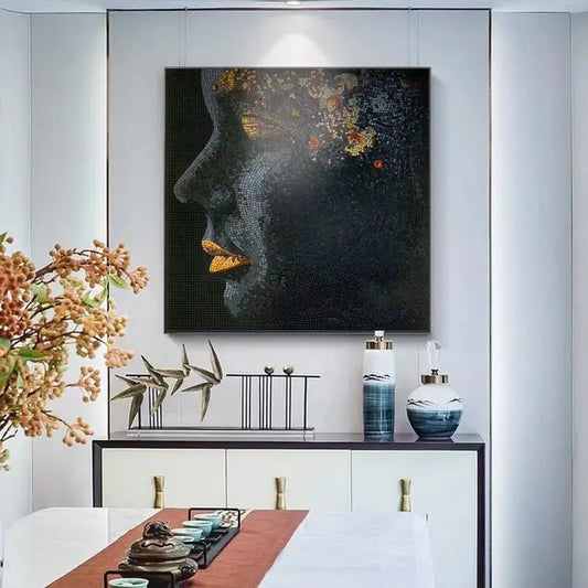 Contemporary stone mosaic portrait artwork displayed in modern dining room interior