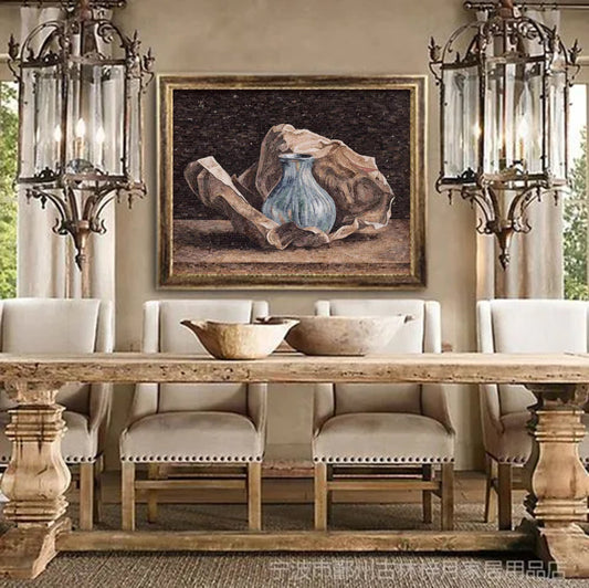 Stone mosaic still life artwork featuring ceramic pitcher and fabric displayed in elegant dining room