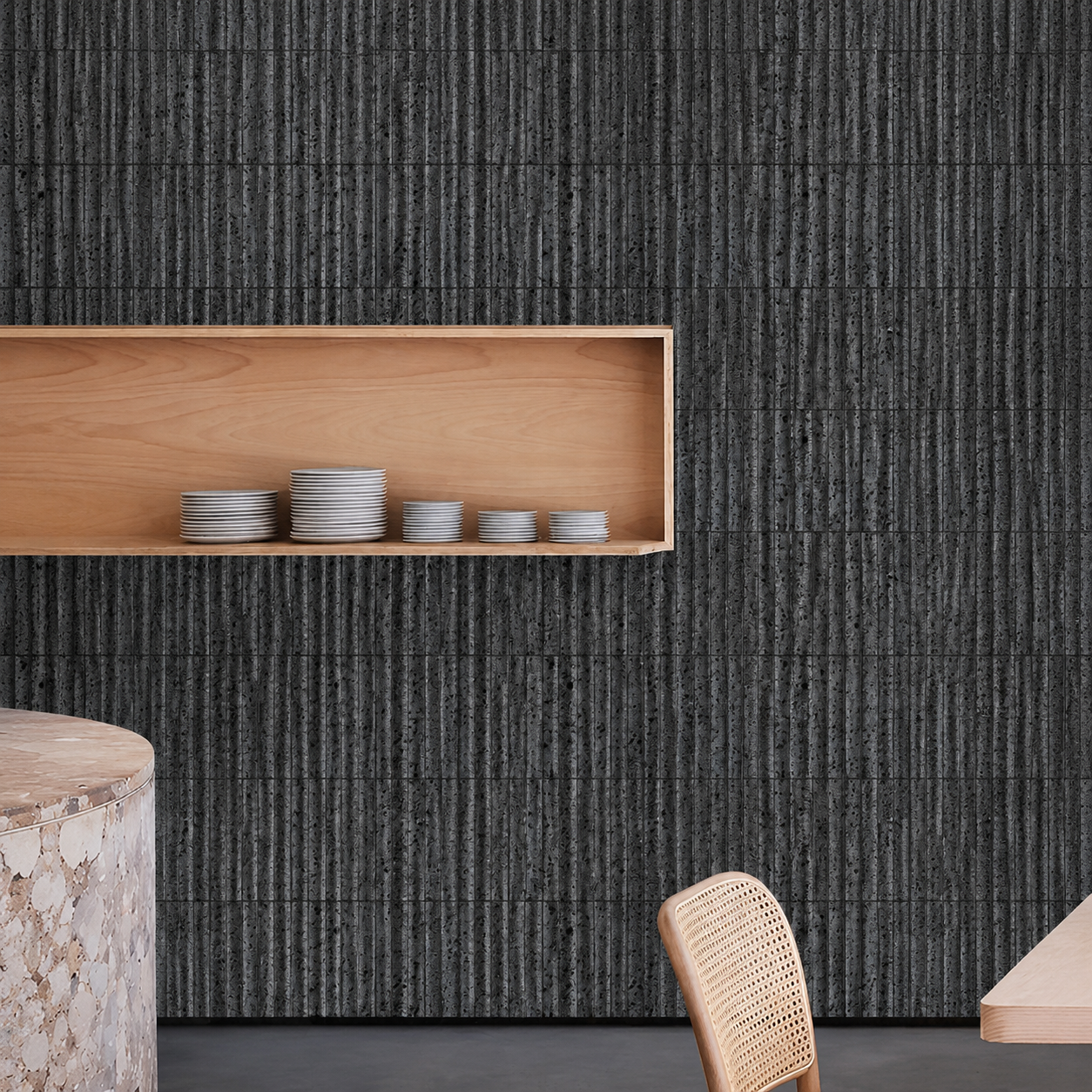 Black lava stone fluted strip mosaic as restaurant background wall with oak shelf